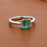Modern Emerald and Diamond Platinum Ring