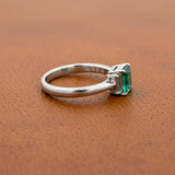 Modern Emerald and Diamond Platinum Ring
